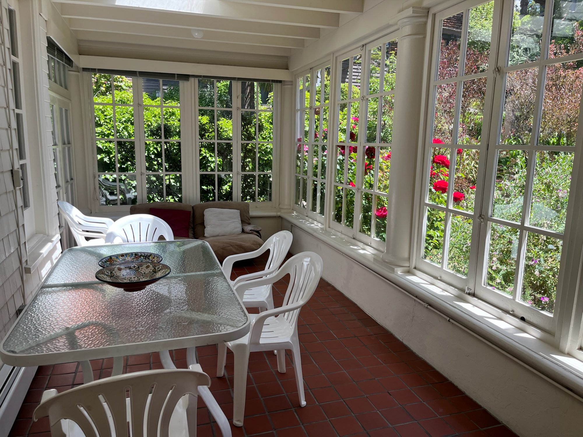 Blue tiled bathroom with tub/shower