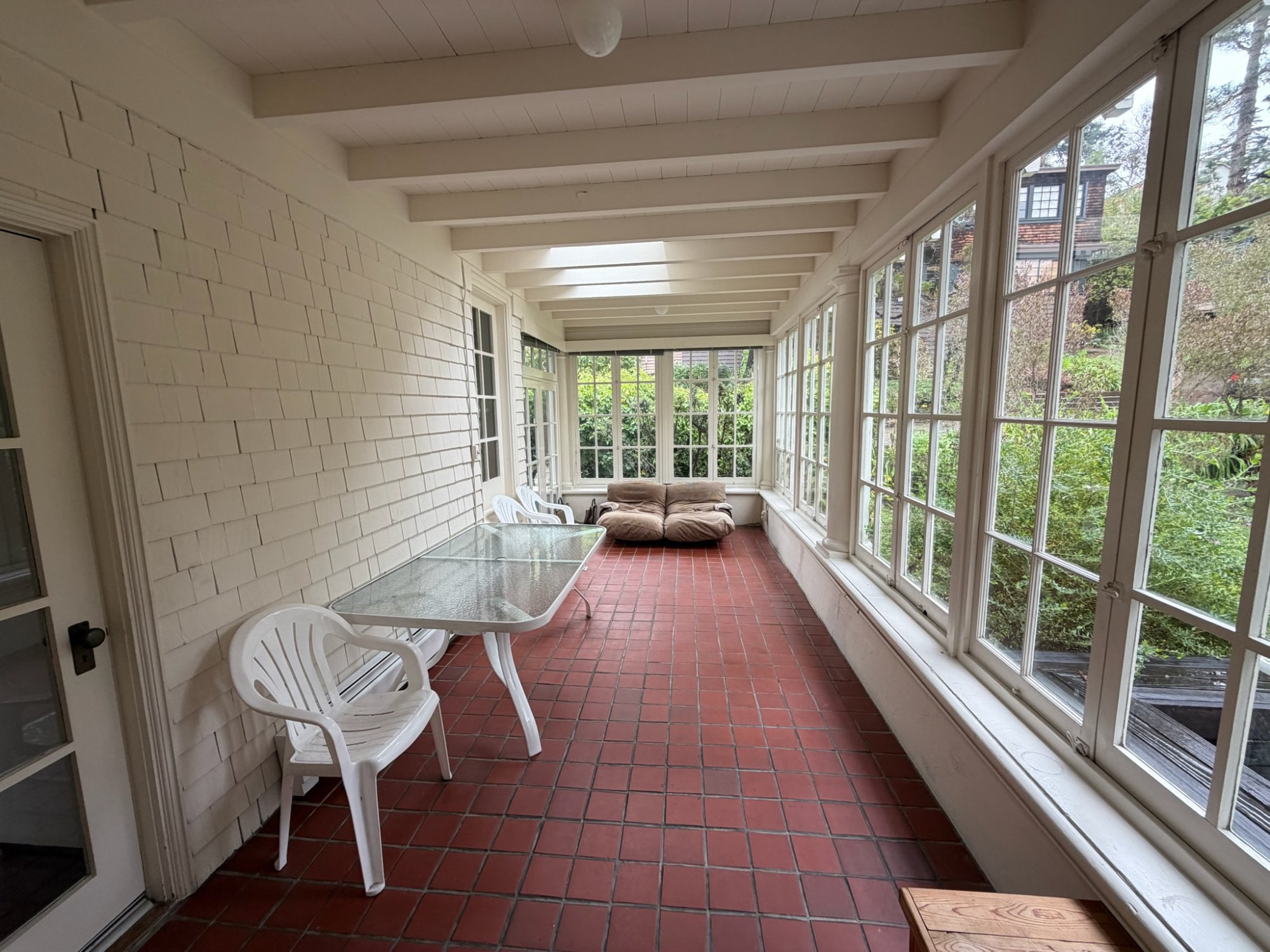 Sunroom with terracotta tile floor