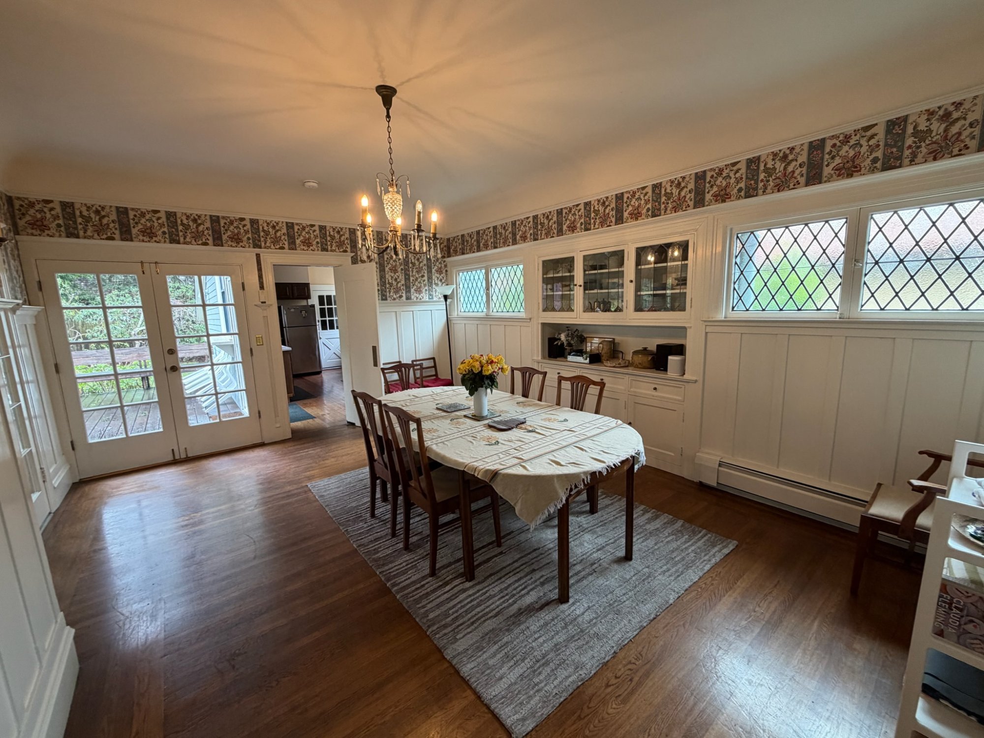 Dining room with chandelier and leaded glass windows