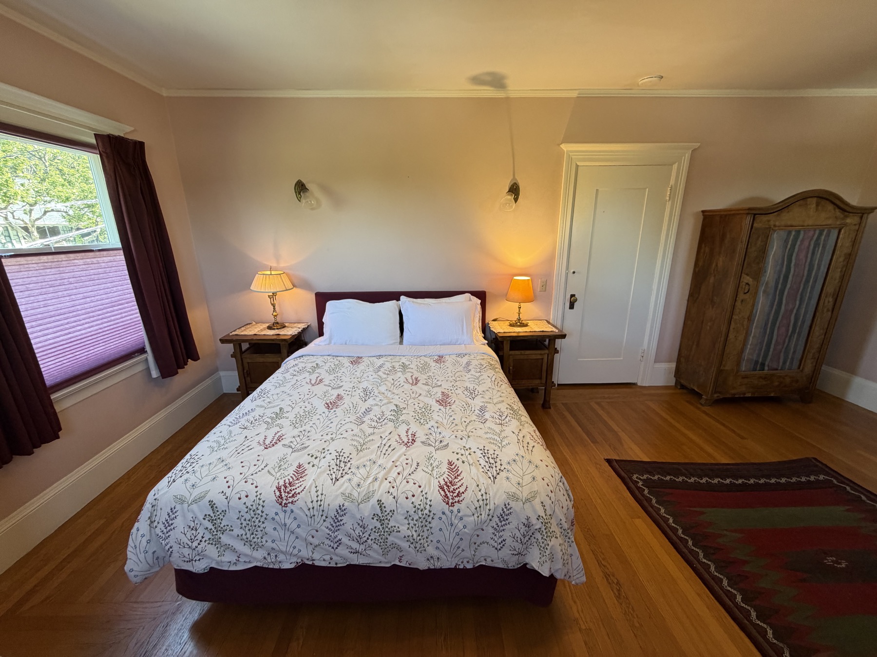 West bedroom queen bed with armoire