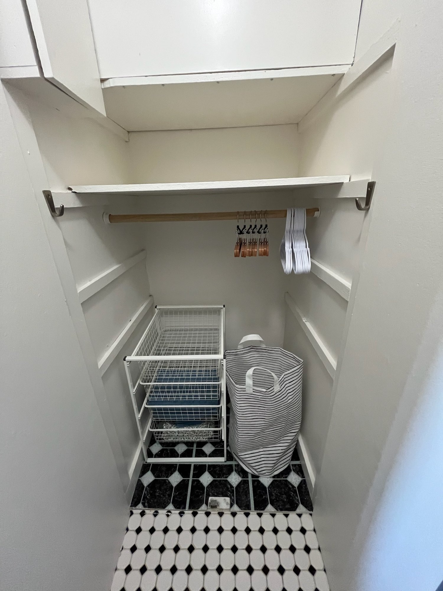 Walk-in closet with built-in shelving and storage