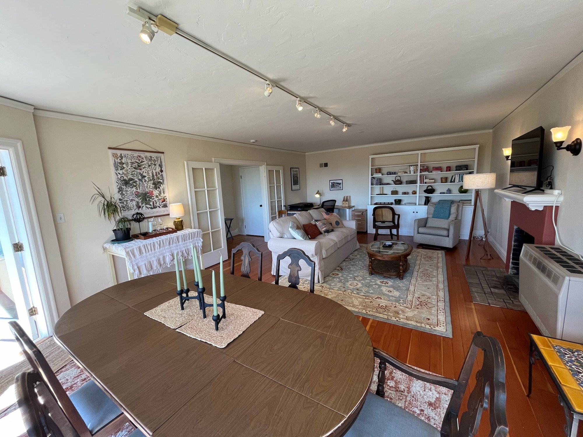 Dining room looking into the bright open living room