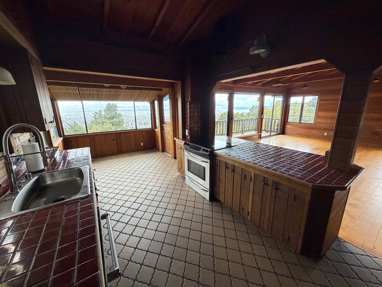 Full kitchen with stainless appliances and bay views