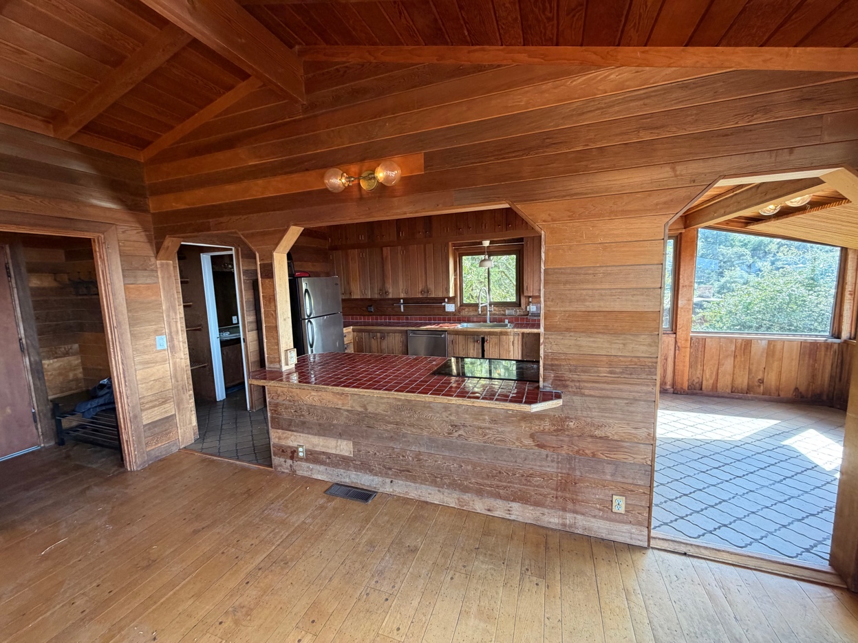 Open living and kitchen area with panoramic Bay views