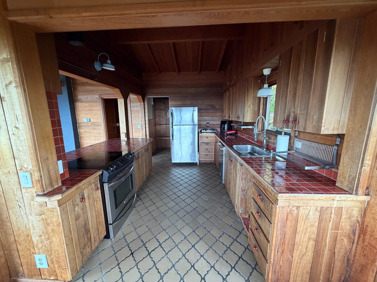 Kitchen with tile counters and open layout