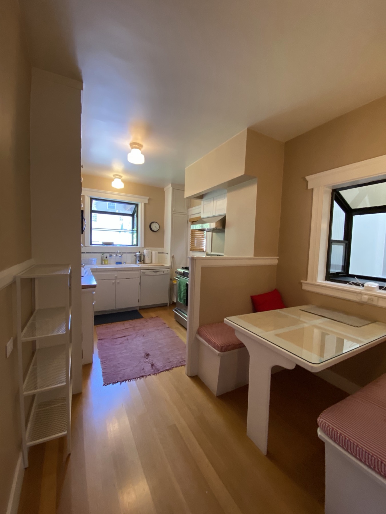 Kitchen showing built-in breakfast banquette and original details