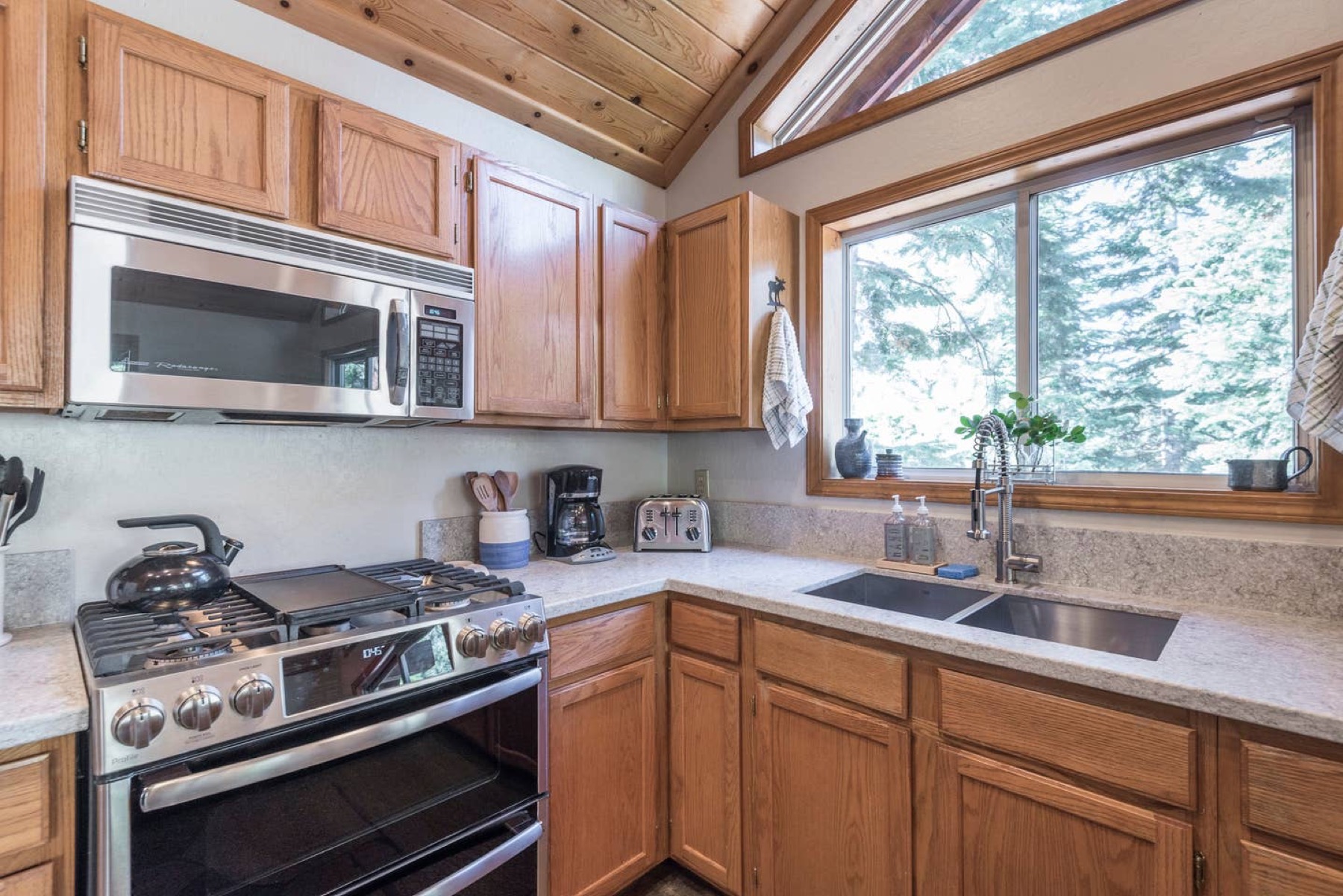 Kitchen prep area with microwave and granite counters