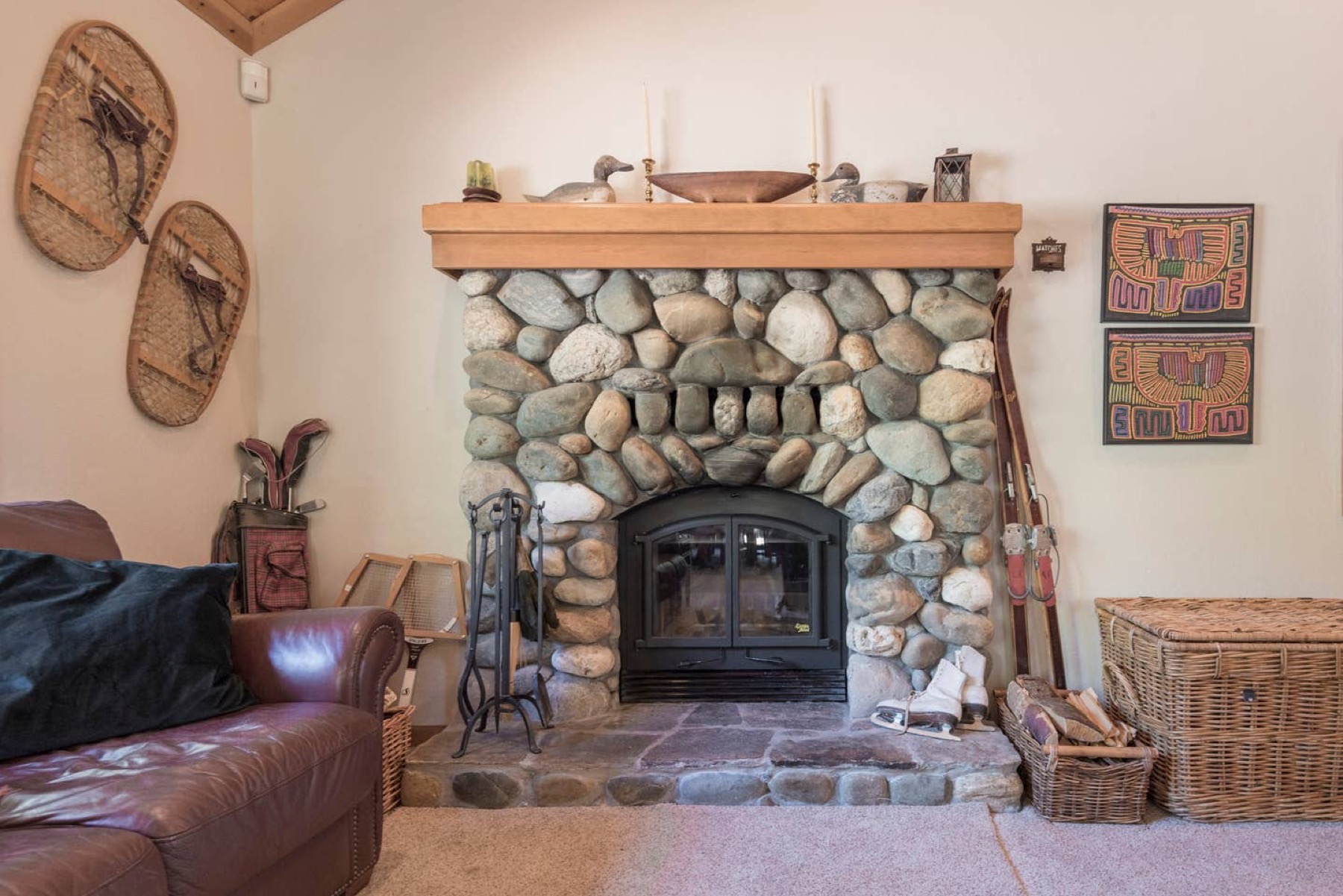 Classic river-rock wood-burning fireplace